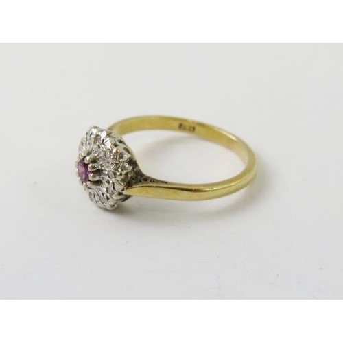 531 - An 18ct white gold ruby and diamond cluster ring, finger size L, 2.7gms approx. 
Condition report: G... 