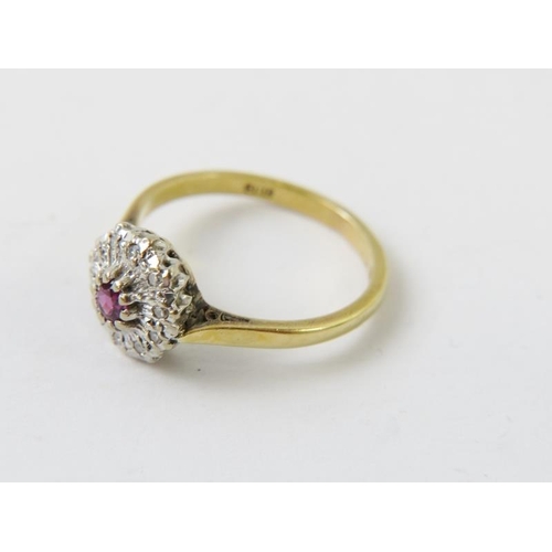 531 - An 18ct white gold ruby and diamond cluster ring, finger size L, 2.7gms approx. 
Condition report: G... 