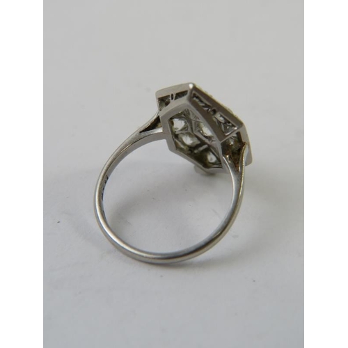 572 - An Art Deco style white precious metal and diamond tablet ring, the setting measuring approx 20mm x ... 