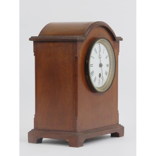 6 - A mahogany mantel clock, late 19th/early 20th century. With a gilt brass and enamelled Roman Numeral... 