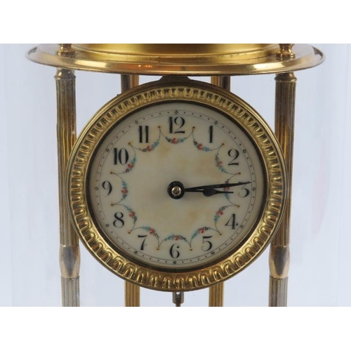 69 - A large French gilt metal anniversary clock with glass dome. Enamelled dial decorated with floral sw... 