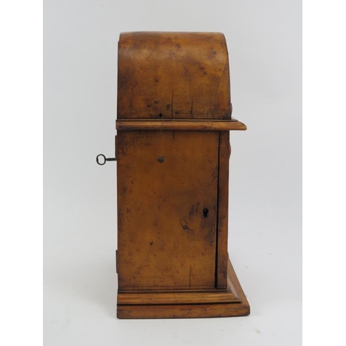 70 - A French birds eye maple housed capucine clock, 19th century. The capucine travel alarm clock housed... 