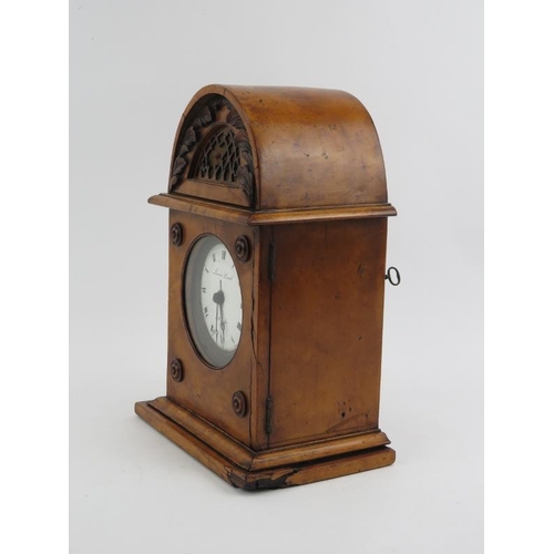 70 - A French birds eye maple housed capucine clock, 19th century. The capucine travel alarm clock housed... 