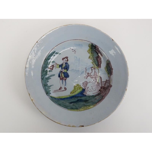 8 - An English Delftware polychrome decorated ceramic plate, Liverpool, mid 18th century. Decorated depi... 