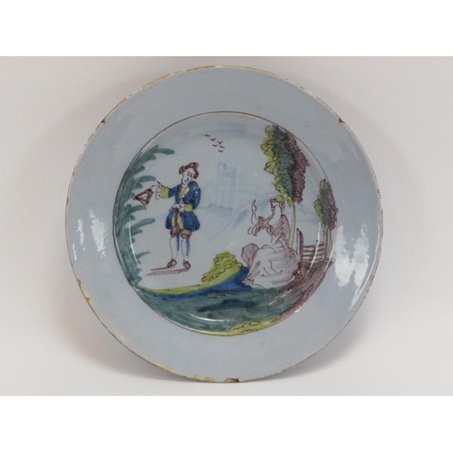 8 - An English Delftware polychrome decorated ceramic plate, Liverpool, mid 18th century. Decorated depi... 