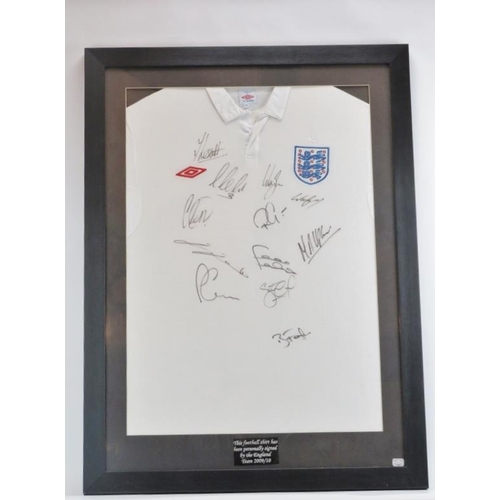 82 - An England Football Team training shirt signed by the England Team 2009/10. Wayne Rooney, Joleon Les... 