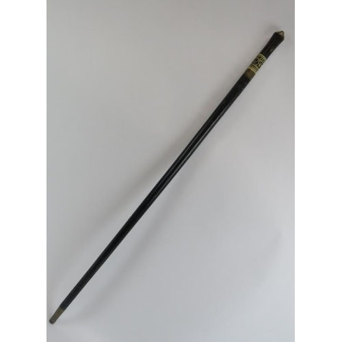 83 - An Anglo Indian ebonised, carved bone and brass mounted sword stick walking cane, late 19th/early 20... 