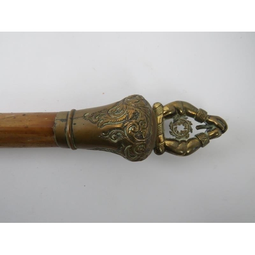 84 - An antique metal mounted Malacca staff, 19th century. Mounted with a family crest. 137.5 cm length. ... 