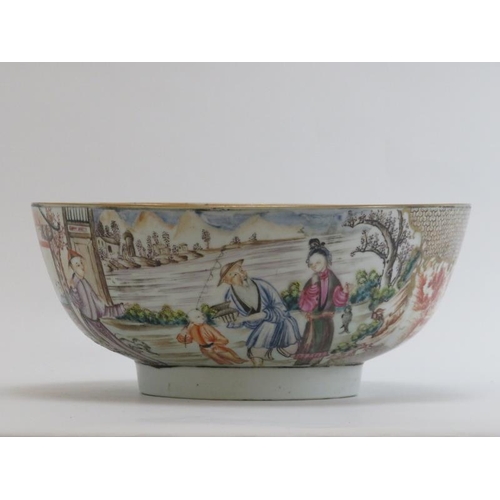 9 - A Chinese Export famille rose gilt and polychrome decorated punch bowl, Qianlong period. Decorated t... 