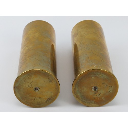 166 - Two WWI six pounder shells with unusual engraved figural decoration. Both dated 1917. (2 items) 18.5... 