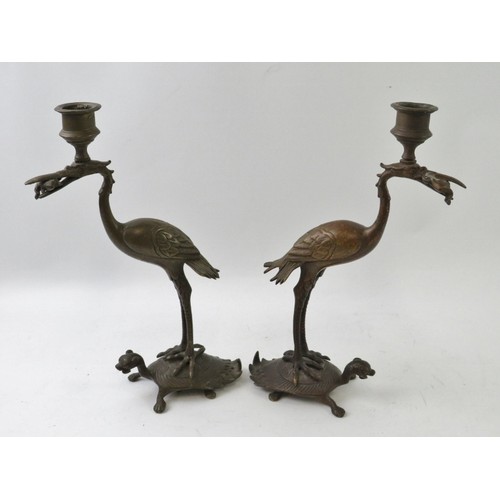 77 - A pair of Japanese crane and tortoise candlesticks, late Meiji/Taisho period. Both cranes depicted r... 