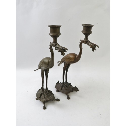 77 - A pair of Japanese crane and tortoise candlesticks, late Meiji/Taisho period. Both cranes depicted r... 