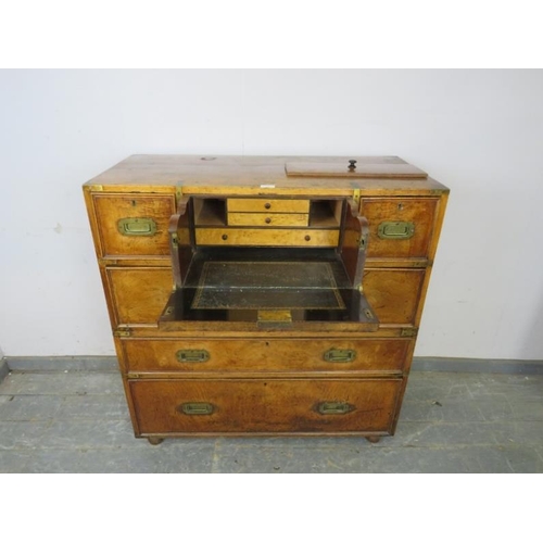 710 - A good 19th century walnut military secretaire chest, housing a central mahogany lined secretaire se... 