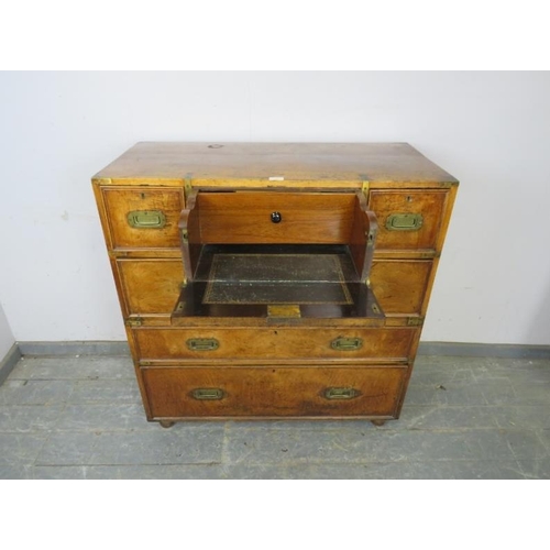 710 - A good 19th century walnut military campaign secretaire chest, housing a central mahogany lined secr... 