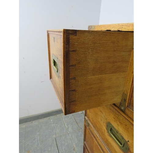 710 - A good 19th century walnut military secretaire chest, housing a central mahogany lined secretaire se... 