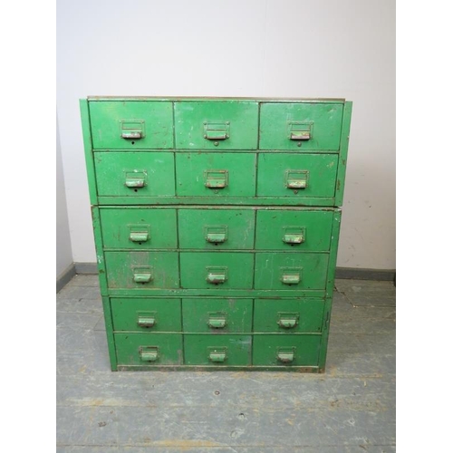 719 - A vintage industrial steel bank of 18 drawers, having scalloped handles and name plate holders, pain... 