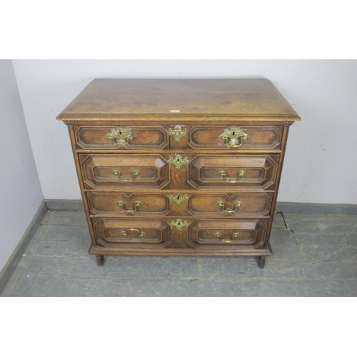 722 - A 17th century Jacobean oak chest, housing two short above three long elm & oak lined graduated draw... 