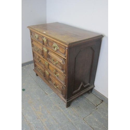 722 - A 17th century Jacobean oak chest, housing two short above three long elm & oak lined graduated draw... 