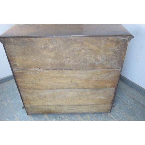 722 - A 17th century Jacobean oak chest, housing two short above three long elm & oak lined graduated draw... 