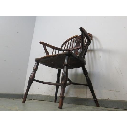 728 - A 19th century elm and yew wood low-back Windsor chair, having shaped and pierced splat, the turned ... 