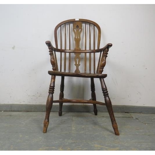 729 - A 19th century elm high-back Windsor chair, having shaped and pierced splat, on turned supports with... 