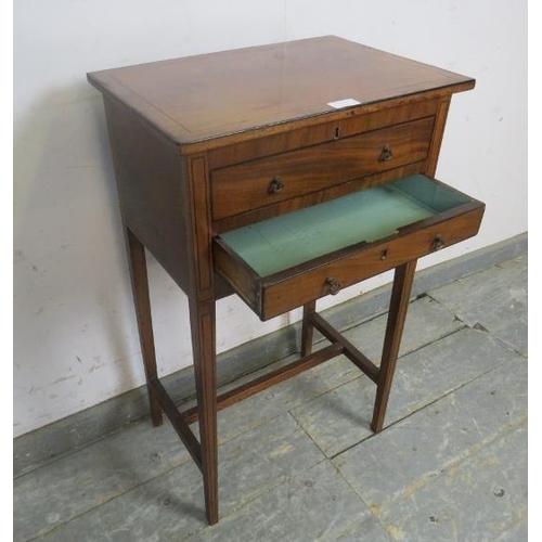 732 - A Georgian mahogany and walnut worktable strung with ebony, the hinged lid opening onto a storage we... 