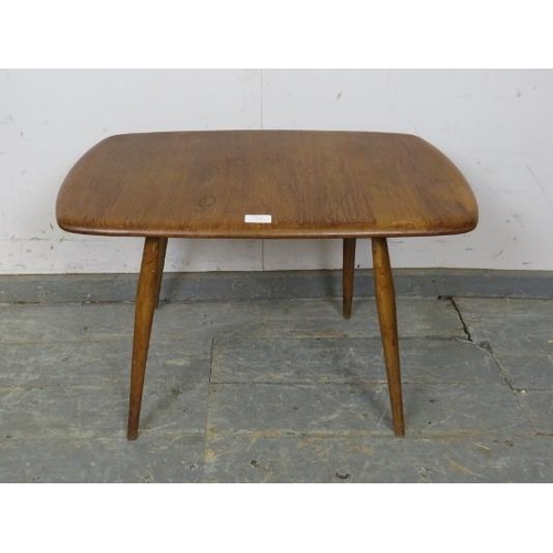 734 - A mid-century elm and beech Ercol Windsor coffee table, on canted supports. c1960. 
H45 x W69 x D42c... 