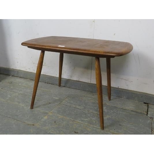 734 - A mid-century elm and beech Ercol Windsor coffee table, on canted supports. c1960. 
H45 x W69 x D42c... 