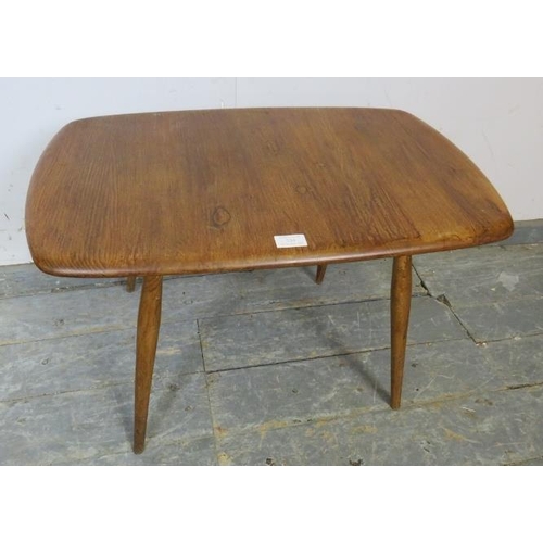 734 - A mid-century elm and beech Ercol Windsor coffee table, on canted supports. c1960. 
H45 x W69 x D42c... 