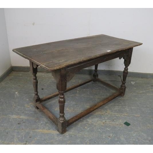 738 - An early 18th century oak side table, on turned and block supports with stretchers. 
H64 x W121 x D6... 