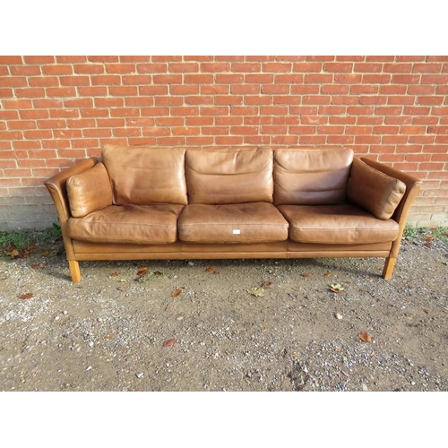 739 - A vintage Danish three-seater sofa in the manner of Borge Morgenson by Stouby, upholstered in supple... 