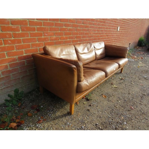 739 - A vintage Danish three-seater sofa in the manner of Borge Morgenson by Stouby, upholstered in supple... 