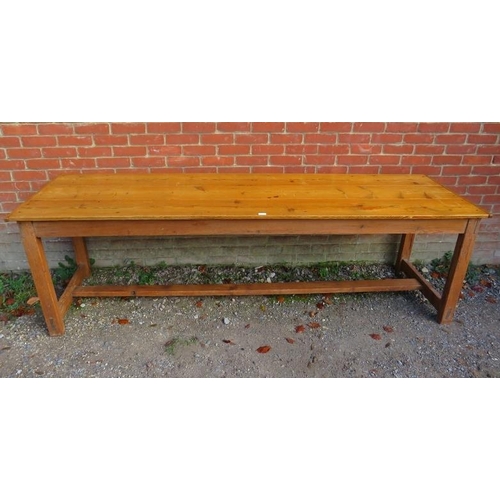 741 - A Continental antique pine long and narrow farmhouse kitchen table, the planked top on square suppor... 