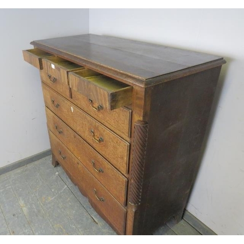 744 - A large George III oak chest, housing three blind drawers above two short and three long graduated d... 