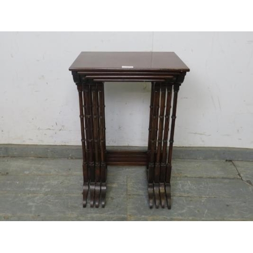 747 - An Edwardian mahogany set of four nesting tables strung with satinwood, on faux bamboo supports with... 