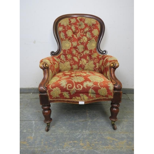 754 - A Victorian mahogany spoonback buttoned armchair, reupholstered in good quality foliate patterned ma... 