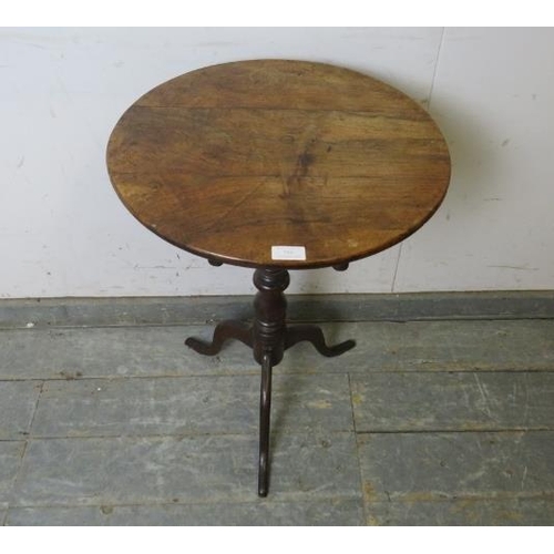 756 - A 19th century walnut and oak tilt-top wine table, on a turned pedestal with delicate splayed tripod... 