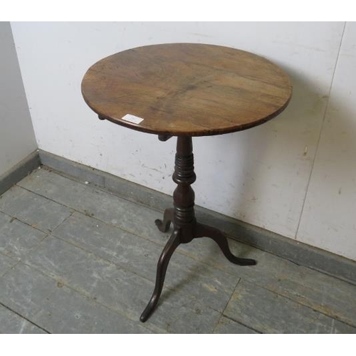 756 - A 19th century walnut and oak tilt-top wine table, on a turned pedestal with delicate splayed tripod... 