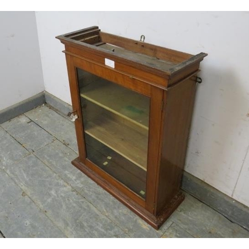 764 - A small antique mahogany wall hanging display cabinet, the glazed door opening onto two fitted shelv... 