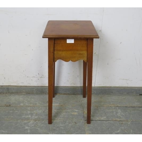 767 - An Arts & Crafts Period walnut plant stand/small side table, the square caddy top above a shaped fri... 