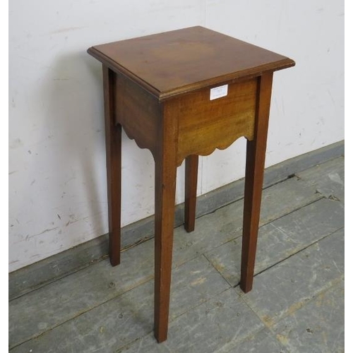 767 - An Arts & Crafts Period walnut plant stand/small side table, the square caddy top above a shaped fri... 