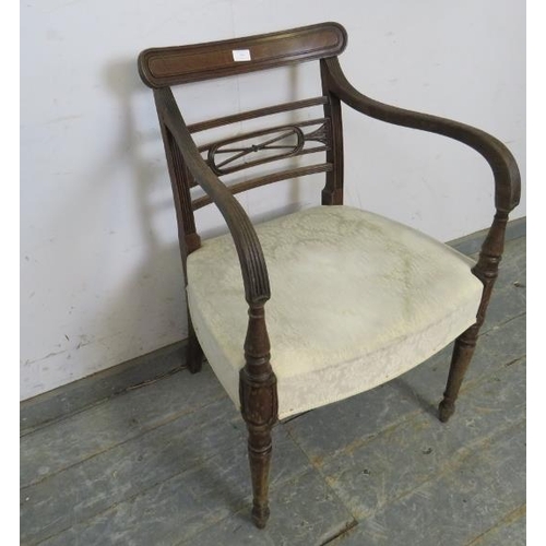 769 - A Regency Period mahogany elbow chair, the backrest with well carved and pierced decoration, joined ... 