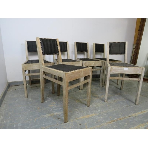 772 - A set of six contemporary limed oak low backed dining chairs, upholstered in black material with bra... 