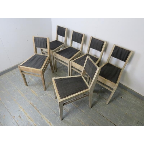 772 - A set of six contemporary limed oak low backed dining chairs, upholstered in black material with bra... 