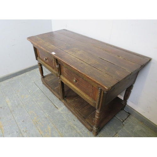 773 - A 19th century country dresser base of small proportions, housing two short drawers with pot-board u... 