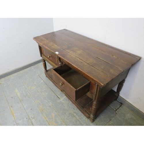 773 - A 19th century country dresser base of small proportions, housing two short drawers with pot-board u... 