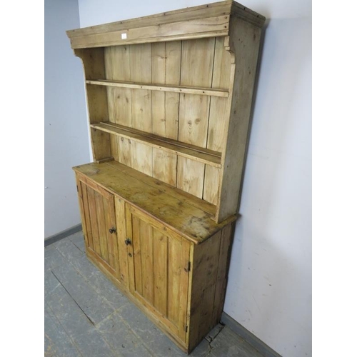 774 - An antique pine cottage sized dresser of unusually narrow proportions, the plate-rack shelving above... 