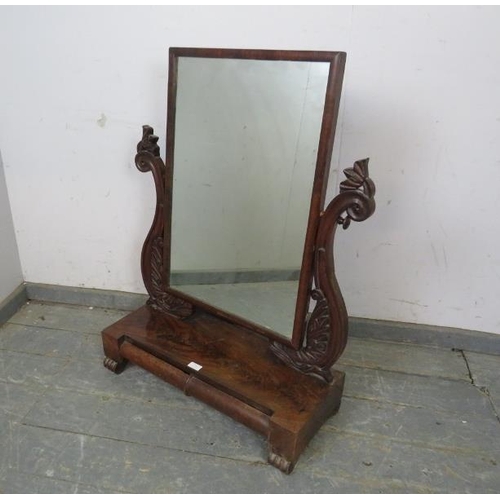 779 - A large early 19th century mahogany swing vanity mirror, the carved side supports modelled as Regenc... 