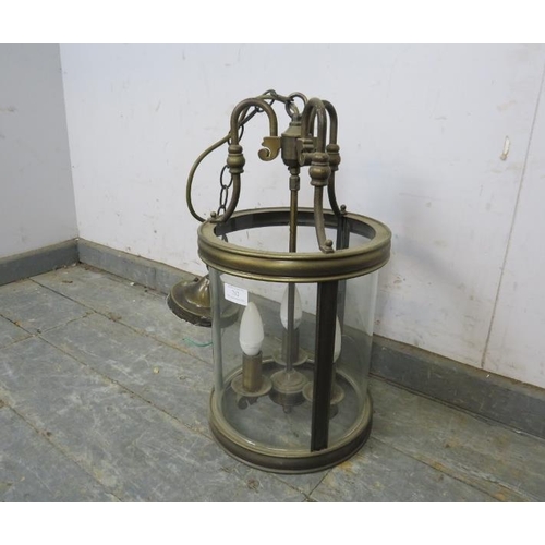 782 - An antique style brass hallway hanging lantern with three branch candelabra.
H48cm Diameter26cm (app... 