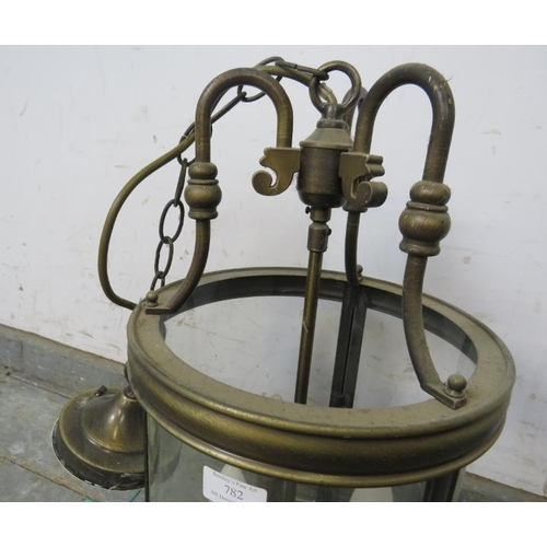 782 - An antique style brass hallway hanging lantern with three branch candelabra.
H48cm Diameter26cm (app... 